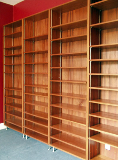 Three-quarter view of a set of tall free-standing bookshelves