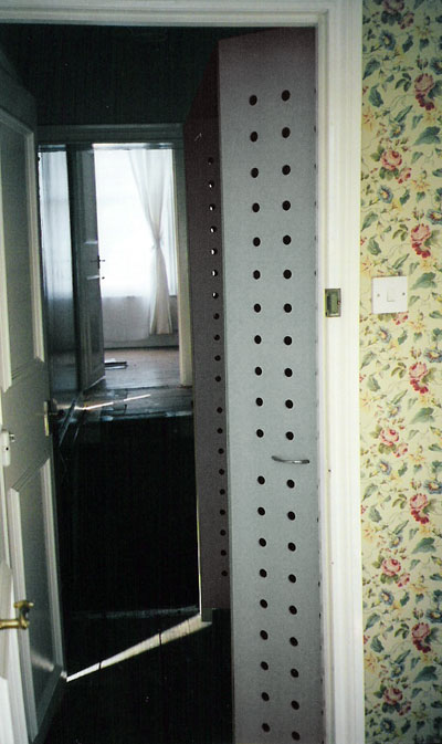 View of gatefold closet doors in a hallway
