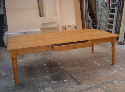 Three-quarter view of a large pine table