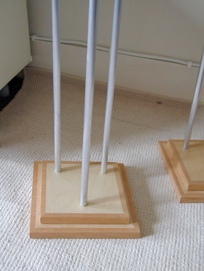 Close up view of the base of a speaker stand