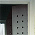 Close-up detail of drilled closet doors