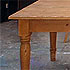 Close-up detail of a large pine table
